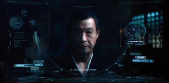 Movie still from “Altered Carbon” (2018), created by Laeta Kalogridis – An image of an older asian man in a dark room; Close Up shot, High angle