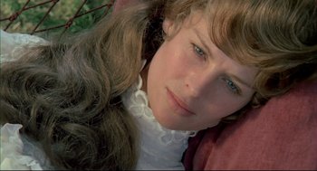 Movie still from “The Go-Between” (1971), directed by Joseph Losey – A person with long hair; Close Up shot, High angle