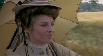 Movie still from “The Go-Between” (1971), directed by Joseph Losey – A woman with a hat and a parasol; Close Up shot, Low angle