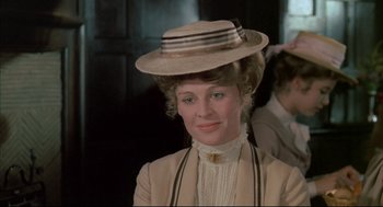 Movie still from “The Go-Between” (1971), directed by Joseph Losey – A person wearing a hat; Close Up shot, Over the shoulder angle