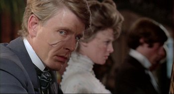 Movie still from “The Go-Between” (1971), directed by Joseph Losey – A man and a woman standing next to each other; Close Up shot, Over the shoulder angle