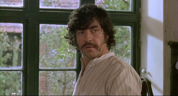 Movie still from “The Go-Between” (1971), directed by Joseph Losey – A person wearing a shirt; Close Up shot, Over the shoulder angle