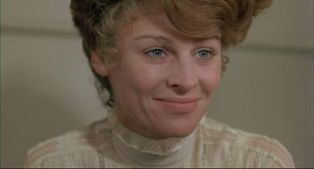 Movie still from “The Go-Between” (1971), directed by Joseph Losey – A person wearing a white shirt; Close Up shot, Over the shoulder angle