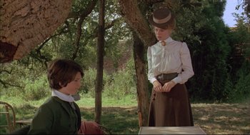 Movie still from “The Go-Between” (1971), directed by Joseph Losey – A young boy and a young woman in a park; Medium shot, Over the shoulder angle