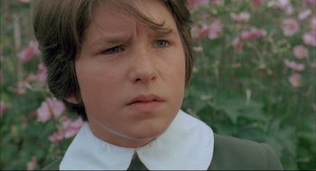 Movie still from “The Go-Between” (1971), directed by Joseph Losey – A person wearing a shirt and tie; Close Up shot, Low angle