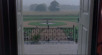 Movie still from “The Go-Between” (1971), directed by Joseph Losey – A view of a park from a balcony; Extreme Wide shot, High angle