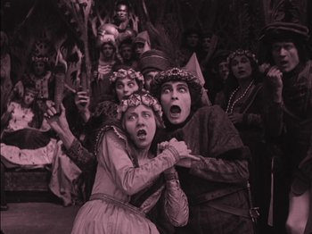 Movie still from “The Golem” (1920), directed by Paul Wegener – A group of people dressed in medieval costumes; Wide shot, High angle