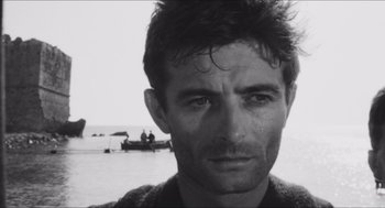 Movie still from “The Gospel According to St. Matthew” (1964), directed by Pier Paolo Pasolini – Black and white photograph of a man in the water; Close Up shot, Low angle