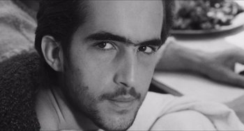 Movie still from “The Gospel According to St. Matthew” (1964), directed by Pier Paolo Pasolini – Black and white photograph of a man with a beard; Close Up shot, Low angle