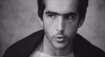 Movie still from “The Gospel According to St. Matthew” (1964), directed by Pier Paolo Pasolini – Black and white photograph of a man with a beard; Close Up shot, Low angle