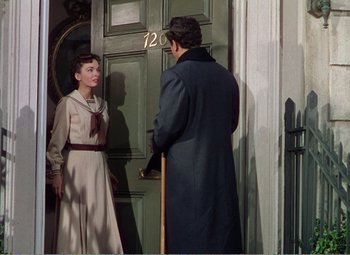 Movie still from “The Great Caruso” (1951), directed by Richard Thorpe – A man and a woman standing in front of a door; Medium shot, Over the shoulder angle
