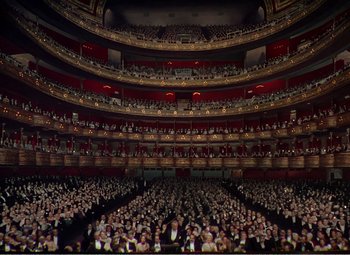 Movie still from “The Great Caruso” (1951), directed by Richard Thorpe – An audience is gathered in a large theater; Extreme Wide shot, High angle