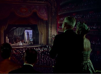 Movie still from “The Great Caruso” (1951), directed by Richard Thorpe – A man and a woman are standing in front of an audience; Extreme Wide shot, Low angle