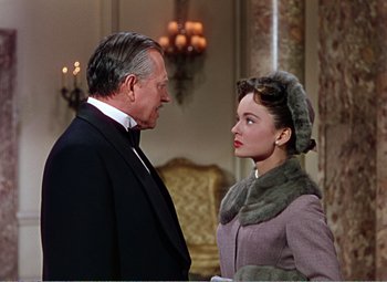 Movie still from “The Great Caruso” (1951), directed by Richard Thorpe – An older man and a young woman standing next to each other; Medium shot, Over the shoulder angle