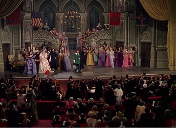 Movie still from “The Great Caruso” (1951), directed by Richard Thorpe – A crowd of people in a large room; Extreme Wide shot, High angle