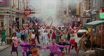 Movie still from “The Great Muppet Caper” (1981), directed by Jim Henson – A group of people standing on a street; Extreme Wide shot, High angle