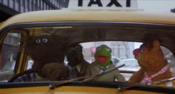 Movie still from “The Great Muppet Caper” (1981), directed by Jim Henson – A group of people in a taxi with masks on; Wide shot, Low angle