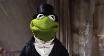 Movie still from “The Great Muppet Caper” (1981), directed by Jim Henson – A frog wearing a top hat and a tuxedo; Close Up shot, Low angle
