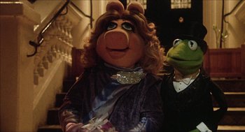 Movie still from “The Great Muppet Caper” (1981), directed by Jim Henson – A woman dressed up as miss piggy and kermit the frog; Close Up shot, High angle
