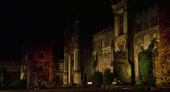 Movie still from “The Great Muppet Caper” (1981), directed by Jim Henson – A building that is lit up at night time; Extreme Wide shot, Low angle