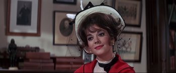 Movie still from “The Great Race” (1965), directed by Blake Edwards – A person wearing a hat; Close Up shot, Over the shoulder angle