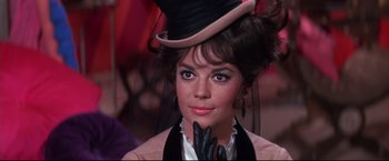 Movie still from “The Great Race” (1965), directed by Blake Edwards – A person wearing a hat and gloves; Close Up shot, Low angle