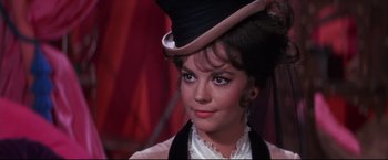 Movie still from “The Great Race” (1965), directed by Blake Edwards – A person wearing a hat; Close Up shot, Over the shoulder angle