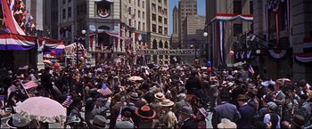 Movie still from “The Great Race” (1965), directed by Blake Edwards – A crowd of people walking down a street; Extreme Wide shot, High angle
