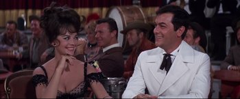 Movie still from “The Great Race” (1965), directed by Blake Edwards – A man and a woman sitting at a table; Medium shot, Over the shoulder angle