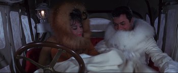 Movie still from “The Great Race” (1965), directed by Blake Edwards – A man and a woman in a bed with a blanket; Medium shot, High angle