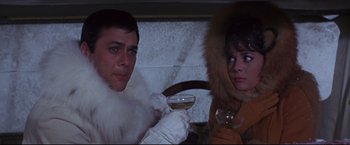 Movie still from “The Great Race” (1965), directed by Blake Edwards – A man and a woman holding a glass of wine; Medium shot, Low angle