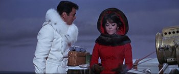 Movie still from “The Great Race” (1965), directed by Blake Edwards – A man and a woman dressed in winter clothing; Medium shot, Low angle