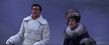 Movie still from “The Great Race” (1965), directed by Blake Edwards – A man and a woman wearing fur coats and hats; Medium shot, Low angle