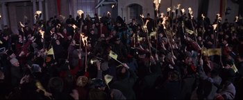 Movie still from “The Great Race” (1965), directed by Blake Edwards – A group of people holding torches in a crowd; Wide shot, High angle