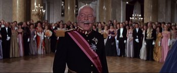 Movie still from “The Great Race” (1965), directed by Blake Edwards – An old man in a military uniform with a mustache; Medium shot, Low angle