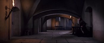 Movie still from “The Great Race” (1965), directed by Blake Edwards – An image of an empty room with a table in the middle of the floor; Wide shot, High angle