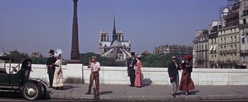 Movie still from “The Great Race” (1965), directed by Blake Edwards – A group of people standing next to each other on a bridge; Extreme Wide shot, High angle
