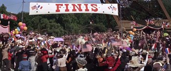 Movie still from “The Great Race” (1965), directed by Blake Edwards – A large crowd of people are gathered in the street; Wide shot, High angle