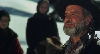 Movie still from “The Great Silence” (1968), directed by Sergio Corbucci – An old man with a beard wearing a cowboy hat; Close Up shot, Low angle