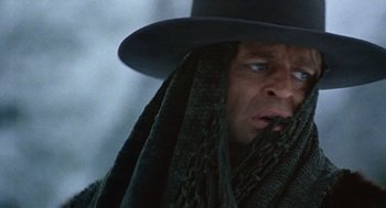 Movie still from “The Great Silence” (1968), directed by Sergio Corbucci – A person wearing a hat and a scarf; Close Up shot, Low angle