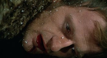 Movie still from “The Great Silence” (1968), directed by Sergio Corbucci – A person's face covered in snow; Extreme Close Up shot, High angle