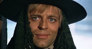 Movie still from “The Great Silence” (1968), directed by Sergio Corbucci – A person wearing a hat; Close Up shot, Low angle