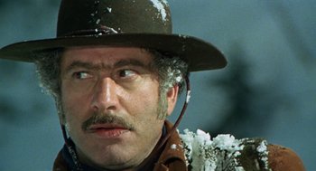 Movie still from “The Great Silence” (1968), directed by Sergio Corbucci – A person wearing a hat; Close Up shot, Low angle