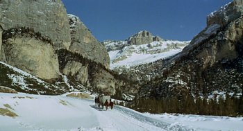 Movie still from “The Great Silence” (1968), directed by Sergio Corbucci – A group of people riding horses through the snow; Extreme Wide shot, High angle
