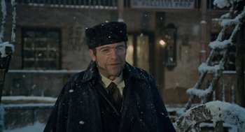 Movie still from “The Great Silence” (1968), directed by Sergio Corbucci – A man wearing a hat and glasses standing in the snow; Close Up shot, Low angle