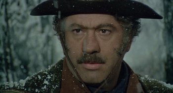 Movie still from “The Great Silence” (1968), directed by Sergio Corbucci – A person wearing a hat; Close Up shot, Low angle