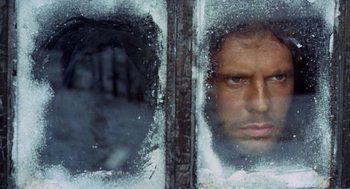 Movie still from “The Great Silence” (1968), directed by Sergio Corbucci – A person looking through a window; Extreme Close Up shot, Low angle