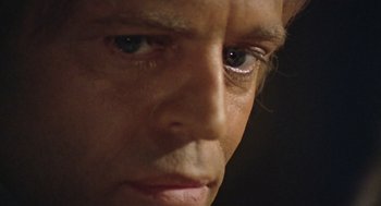 Movie still from “The Great Silence” (1968), directed by Sergio Corbucci – A man's eyes and face; Extreme Close Up shot, Low angle