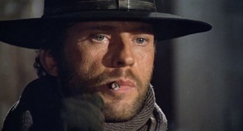 Movie still from “The Great Silence” (1968), directed by Sergio Corbucci – A person wearing a hat; Close Up shot, Low angle