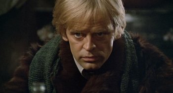 Movie still from “The Great Silence” (1968), directed by Sergio Corbucci – A person wearing a suit and tie; Close Up shot, Low angle